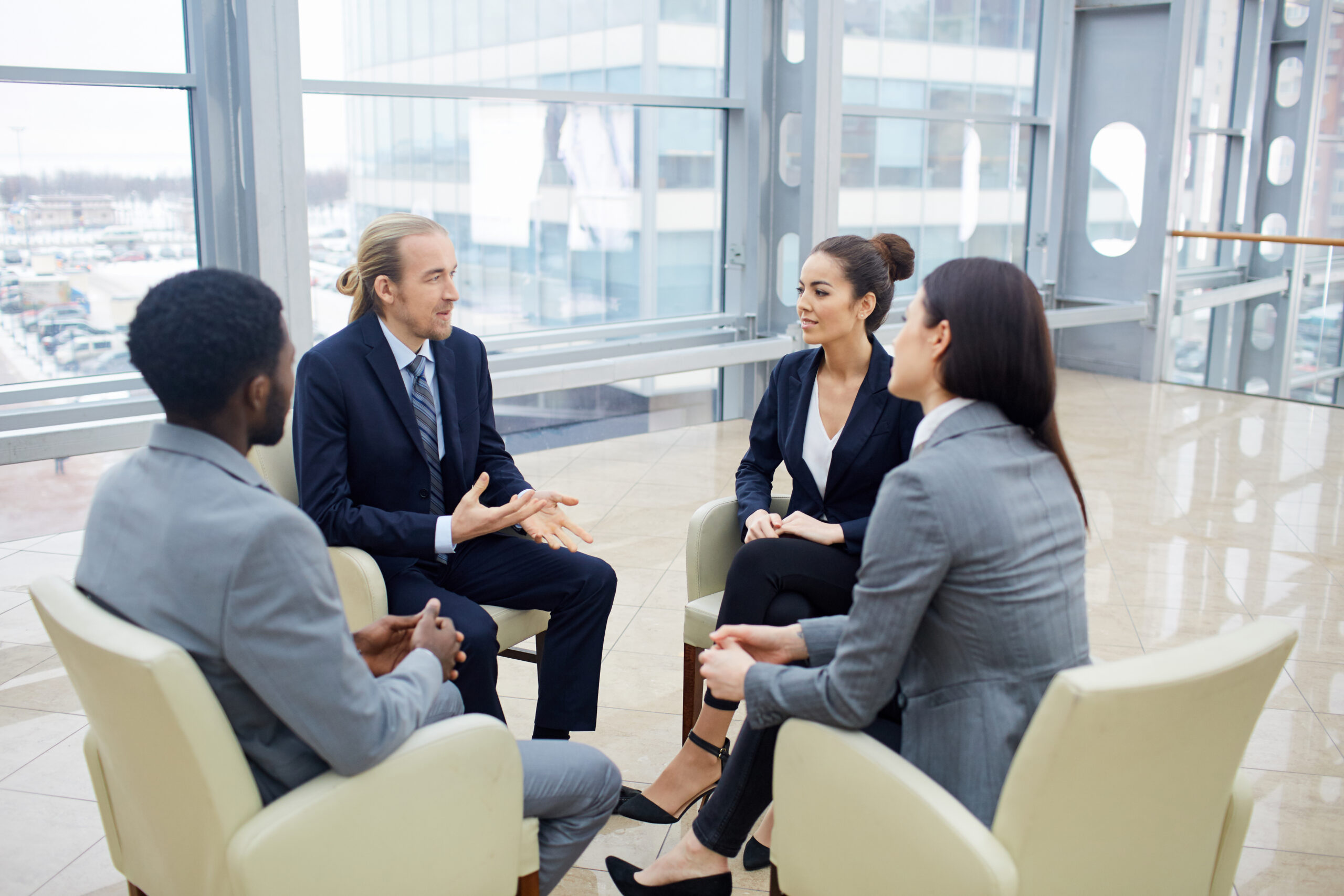 Circle of business partners having discussion of new project or contract